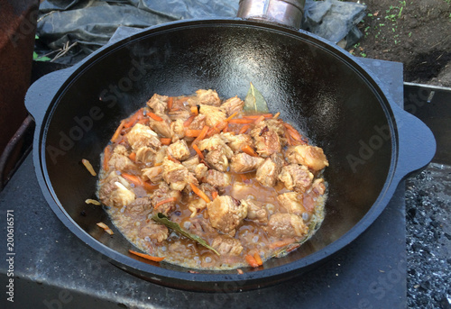 Preparation of pilaf in kazan