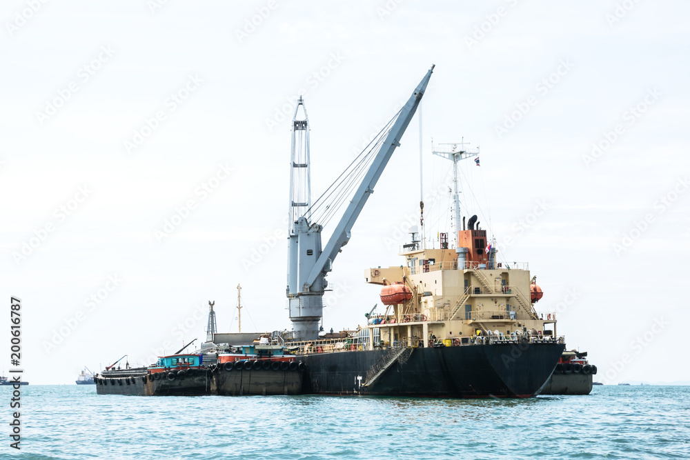 Shipping port, Cargo Ship parking in ocean wait container for logistic Import export in thailand