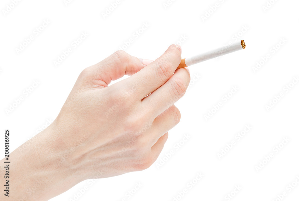 Woman's hand holding cigarette. Isolated on white. Woman's hand holding cigarette. Isolated on white.