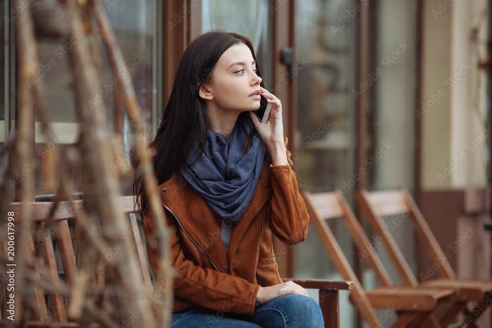 Fototapeta premium Serious brunette listening to her friend