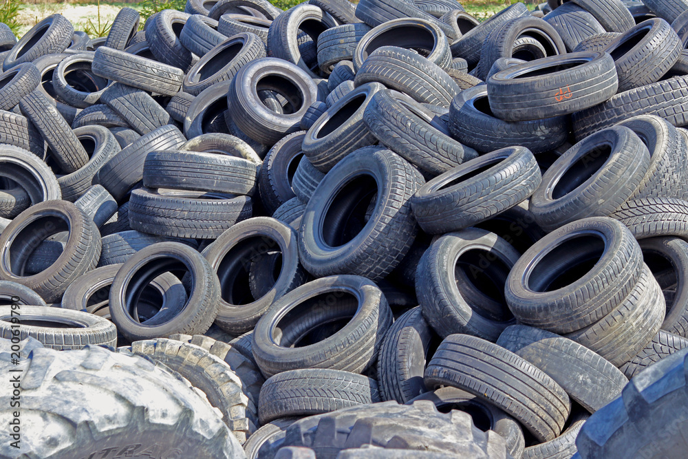 Jaslo/Yaslo, Poland - april 12, 2018: Sweet rubber tires for various cars,  trucks and tractors. Technology of automotive industry. Recycling of  consumables. Preparation for the season. Car repair shop Stock Photo |  Adobe Stock