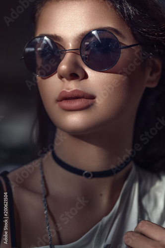 Perfect fashionable lady wearing sunglasses