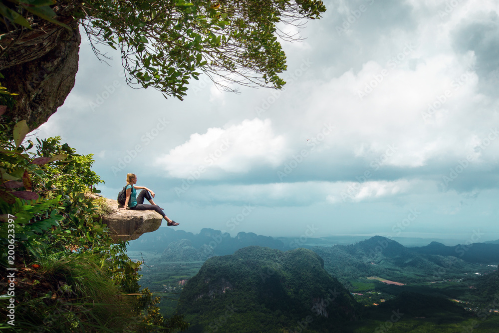 Hiker rest on a cliff,woman enjoy landscape of nature - obrazy, fototapety, plakaty 