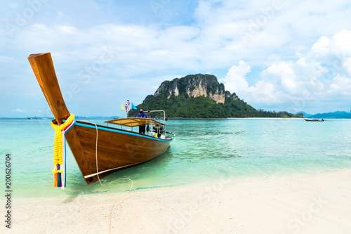 Longtail boat on tropical beach and limestone rock, Mu Koh Poda, Krabi, Thailand