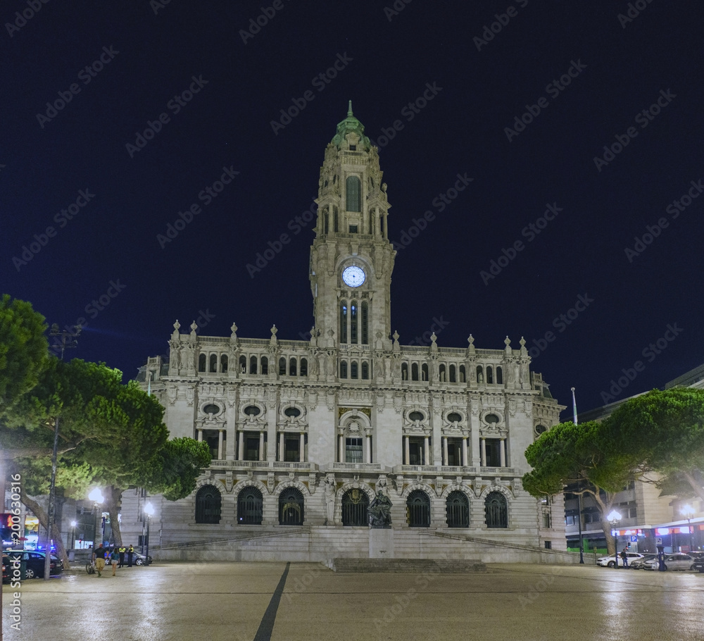 Night view of the facade of the town hall of Porto, Portugal built in granite and marble and with a large tower 70 meters high