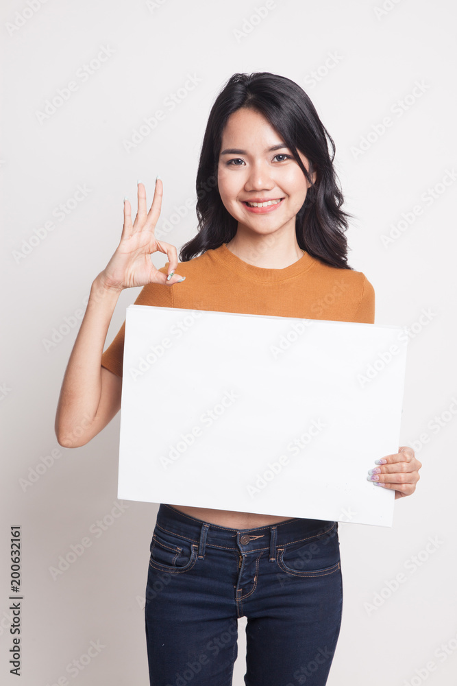 Young Asian woman show OK with white blank sign. Young Asian woman show OK with white blank sign.