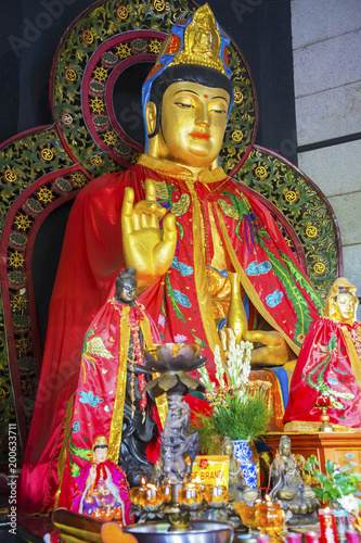 Kwan Im statues inside a temple © Creativa Images