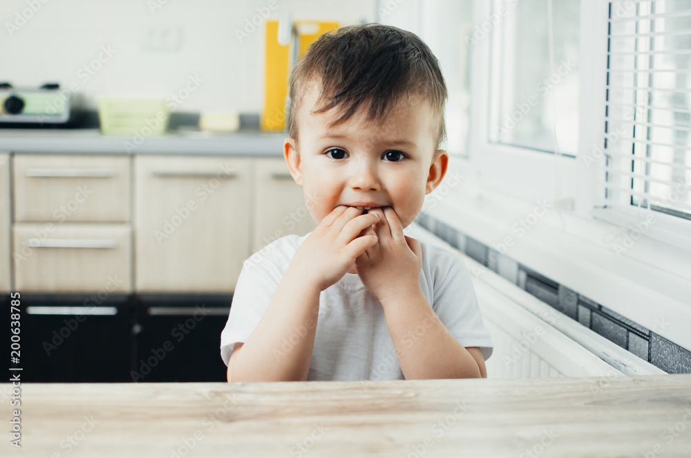 Boy little cute fingers in mouth licking bacteria and germs, hygiene is poor Boy little cute fingers in mouth licking bacteria and germs, hygiene is poor