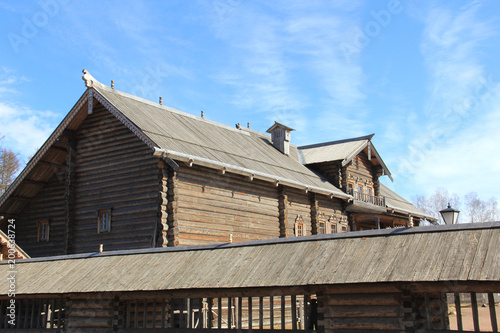 Ancient wooden house against the blue sky