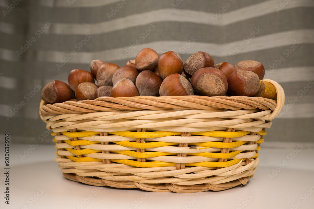 Hazelnuts in a wicker basket. Hazelnuts in a wicker basket.