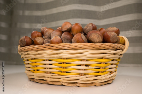 Hazelnuts in a wicker basket.