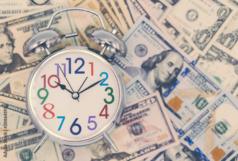 Dollar currency, American Dollars Cash Money with Alarm Clock. Dollar currency, American Dollars Cash Money with Alarm Clock.
