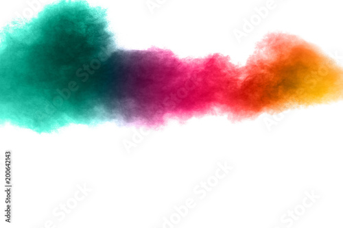Abstract multi color powder explosion on white background. Freeze motion of dust particles splashing. Painted Holi in festival