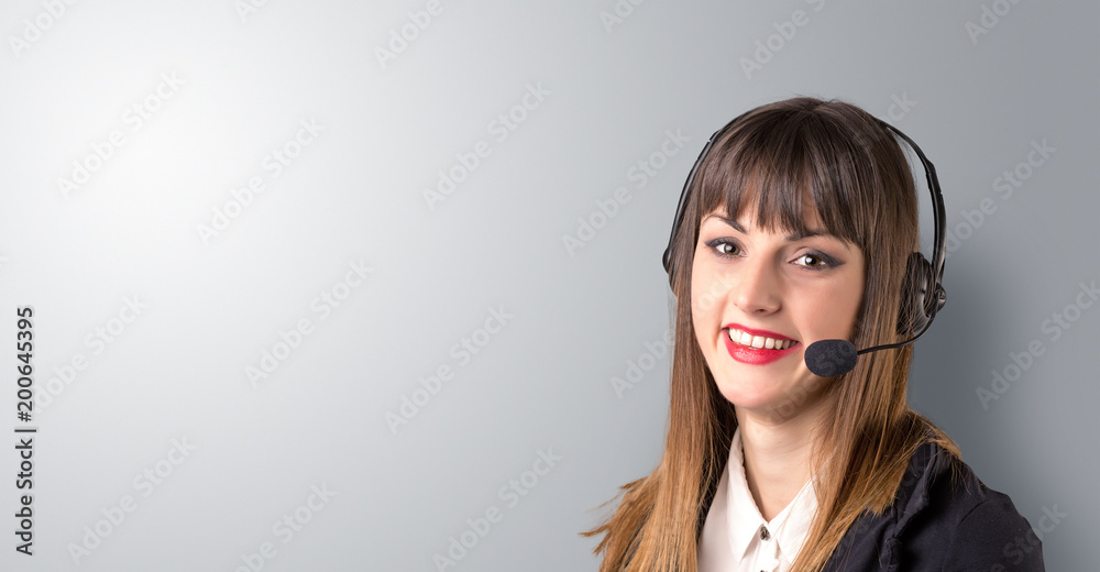 Young female telemarketer on a white background Young female telemarketer on a white background