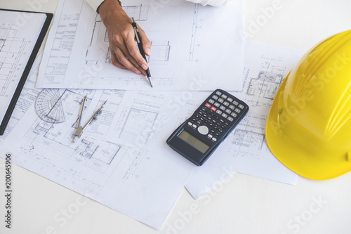 Workplace items tools for project, Architect or Engineer working on blueprint for architectural project in progress, construction and structure concept