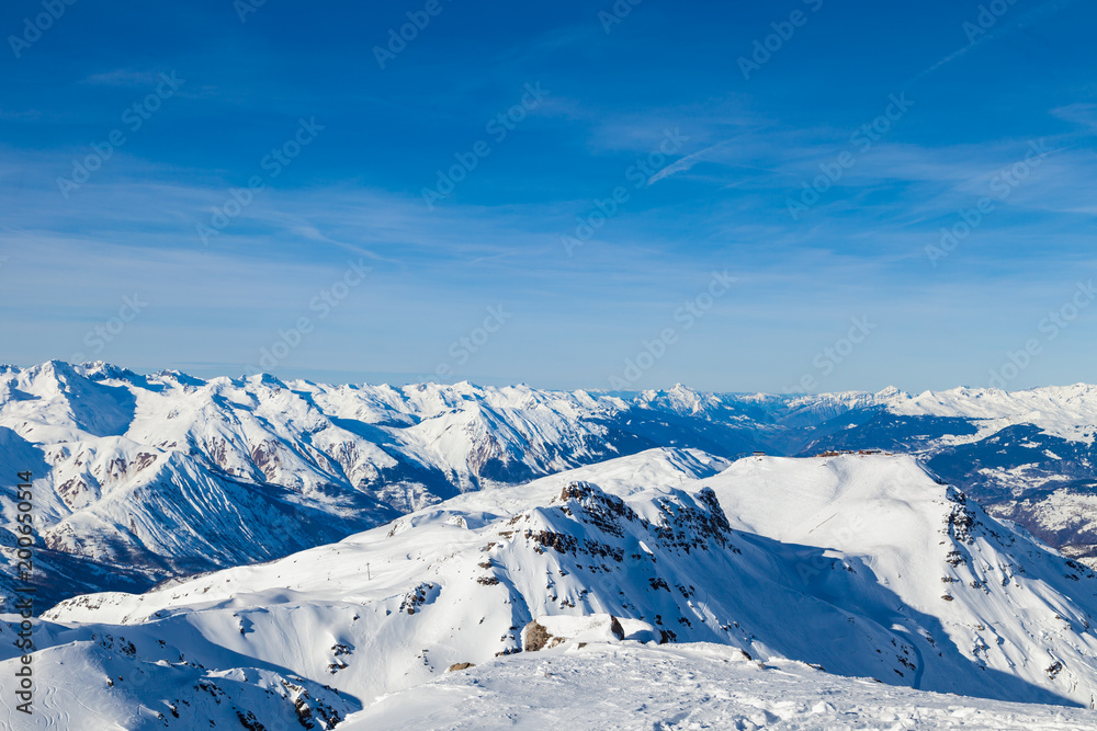 Amazing view to Alps from the mountain top at the french ski resort Three Valleys, Meribel, Courchevel, France.