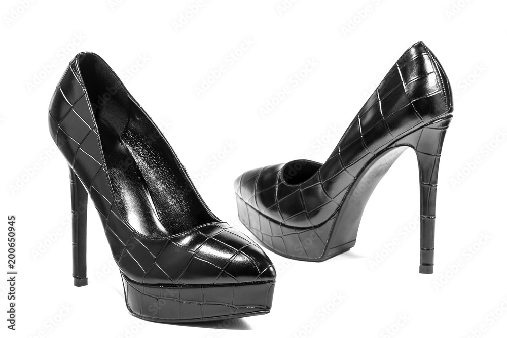 Black high heels isolated on a white background with clipping path for design..Luxury high heels. Black and White. Contrast. Black high heels isolated on a white background with clipping path for design..Luxury high heels. Black and White. Contrast.