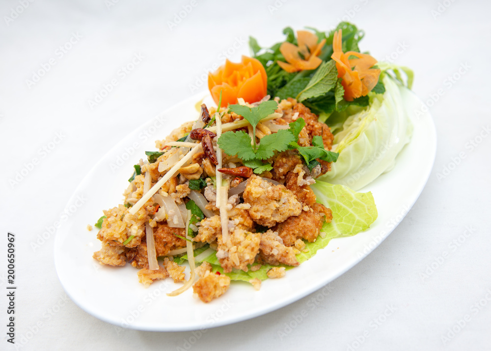 Yam Naem Khao Thot - Spicy Salad with fermented pork, vegetable and rice Yam Naem Khao Thot - Spicy Salad with fermented pork, vegetable and rice