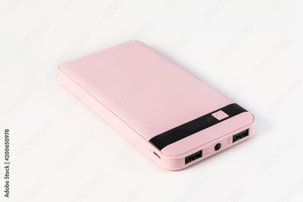 Cute power bank isolated on a white background..Pink power bank. Pink charger. Cute power bank isolated on a white background..Pink power bank. Pink charger.