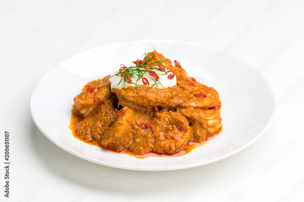 Curry-fried shrimps isolated on a white background. Thai food. Copy space. For design. Thai food concept. Curry-fried shrimps isolated on a white background. Thai food. Copy space. For design. Thai food concept.