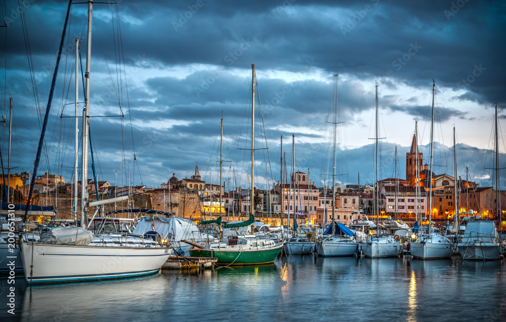Dramatic sky over Alghero harbor at sunset