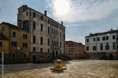 Colourful and historic houses at the Campo della Maddalena in Venice, Italy, with a variety of shapes and sizes in the local architecturural style. photo