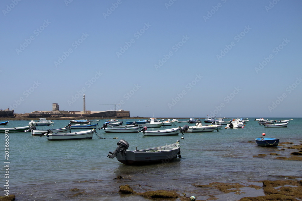 Boats off the Atlantic coast near the fortress of San Sebastian in Cadiz.