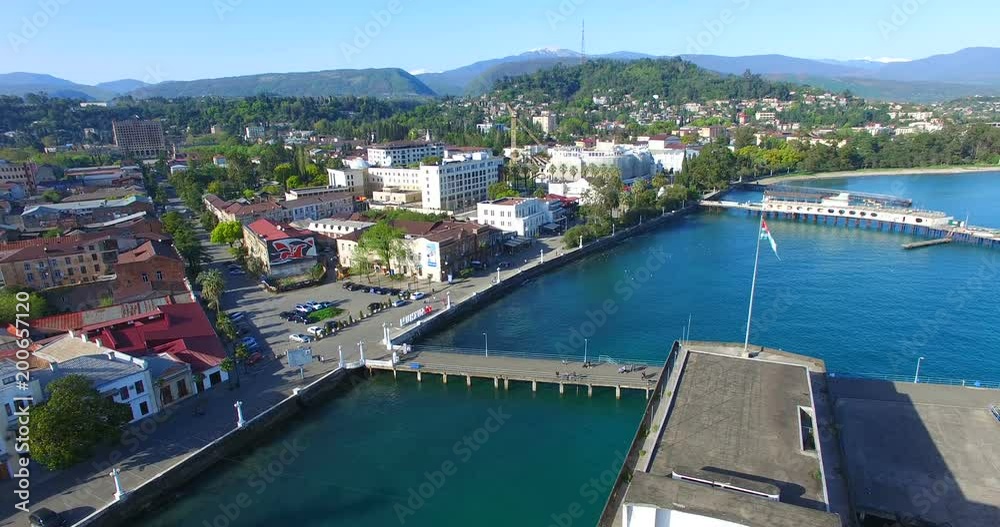 Top view at the sea port of Sukhumi in the background . Top view at the sea port of Sukhumi in the background .