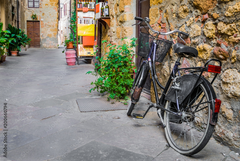Bike in a alley of Pienza, Siena district, Tuscany, Italy, Europe.
