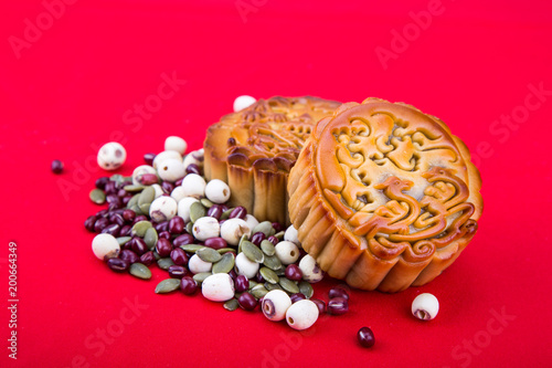 Close-up mooncake, pastries for Chinese mid-autumn festive in red background