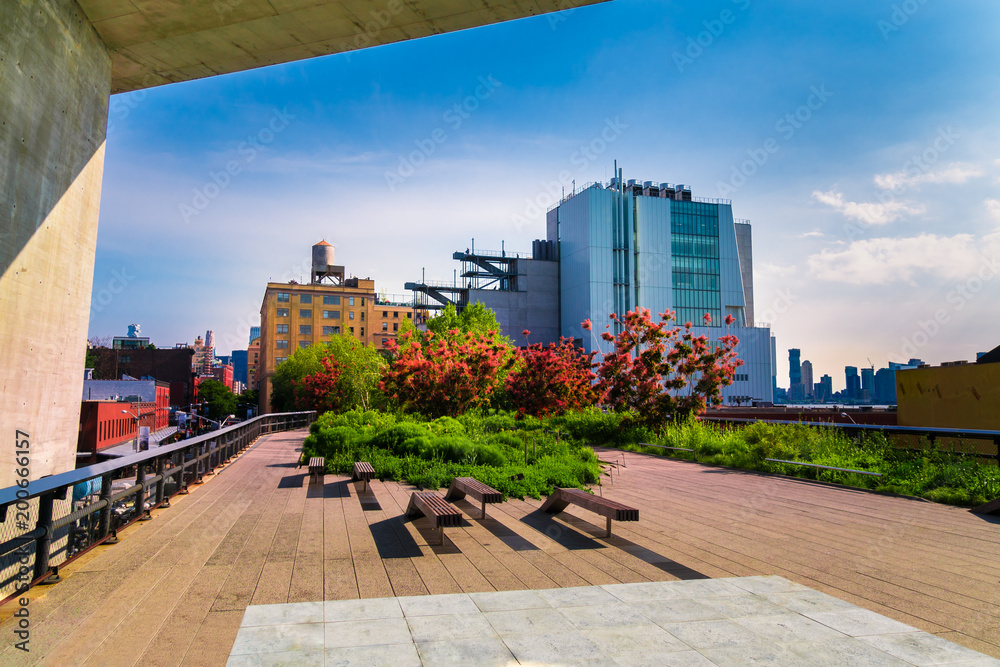 Manhattan, New York City - June 14, 2017: The High Line Park in Manhattan New York. The urban park is popular by locals and tourists built on the elevated train tracks above Tenth Ave in New York City