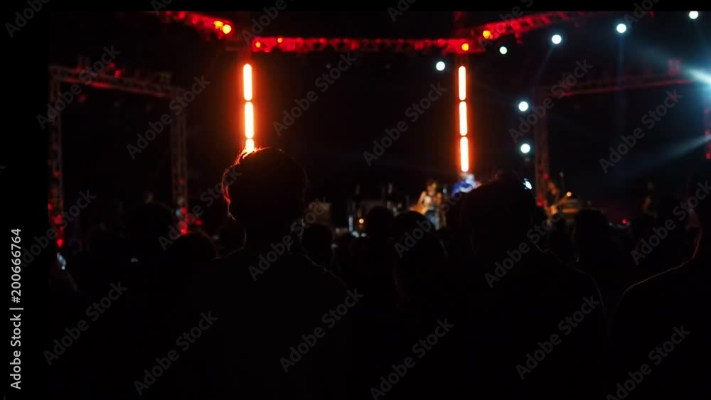 Shot of some cheering fans at a life concert, some visible noise due high ISO, soft focus, also normal speed, Full HD, 1080p. Shot of some cheering fans at a life concert, some visible noise due high ISO, soft focus, also normal speed, Full HD, 1080p.