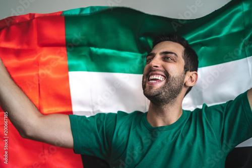 United Arab Emirates Fan Celebrating with Flag