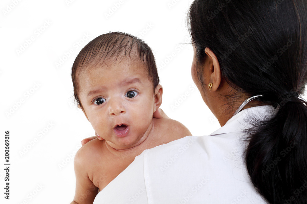Doctor woman holding a newborn baby Doctor woman holding a newborn baby