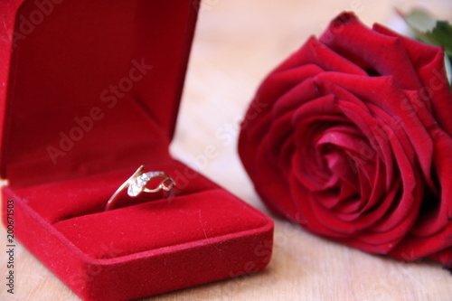 a beautiful gold ring in a red box. © Elena