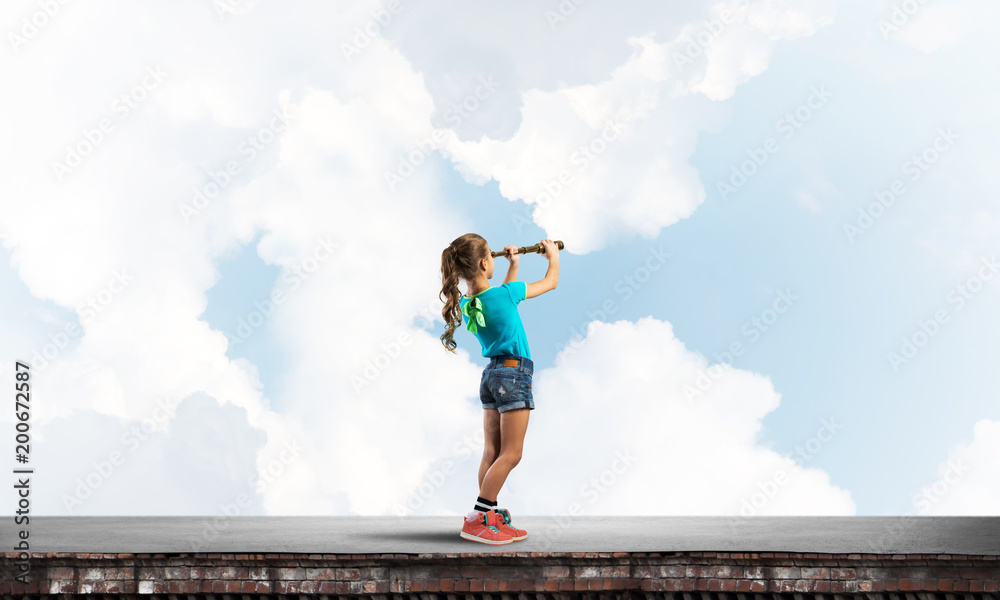 Concept of careless happy childhood with girl exploring this world Concept of careless happy childhood with girl exploring this world