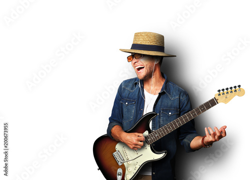 Guy listening to music and playing the guitar