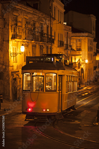 Lisbon tram at night in Alfama photo