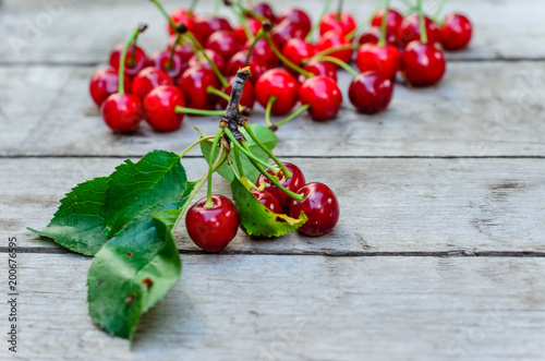 Fresh ripe cherries on wooden table
