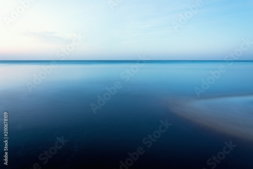 horizontal line of calm sea on the day light photo