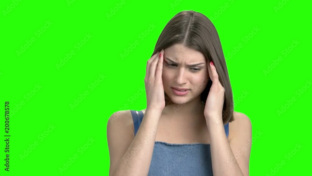 Close up portrait of woman having head pain. Green screen hromakey background for keying. Close up portrait of woman having head pain. Green screen hromakey background for keying.