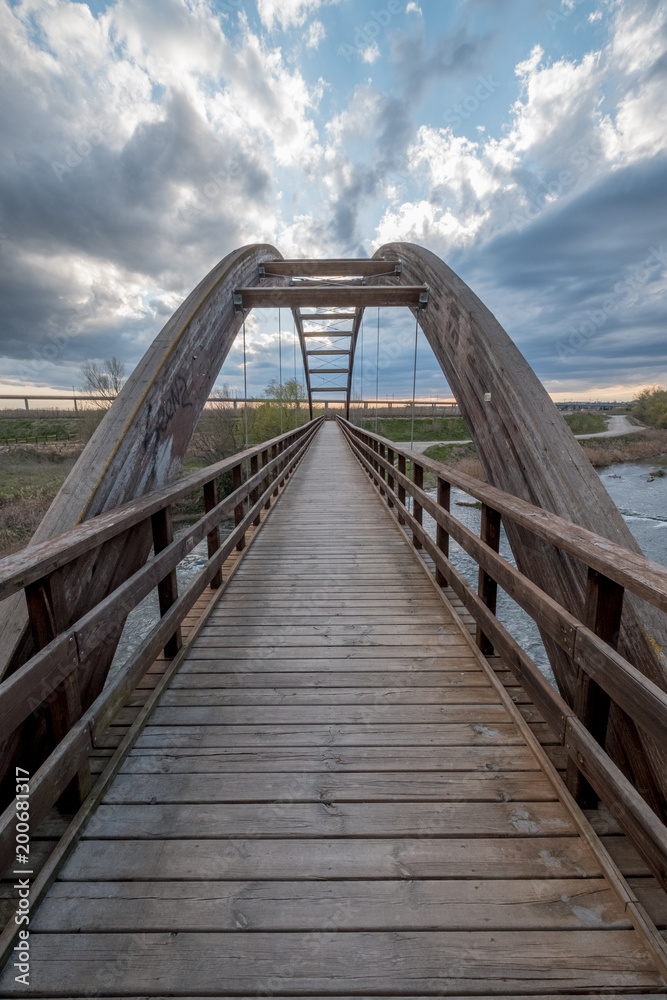 wooden bridge cross river