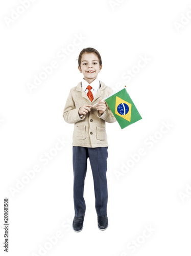 A little boy with Brazilian flag on the white background