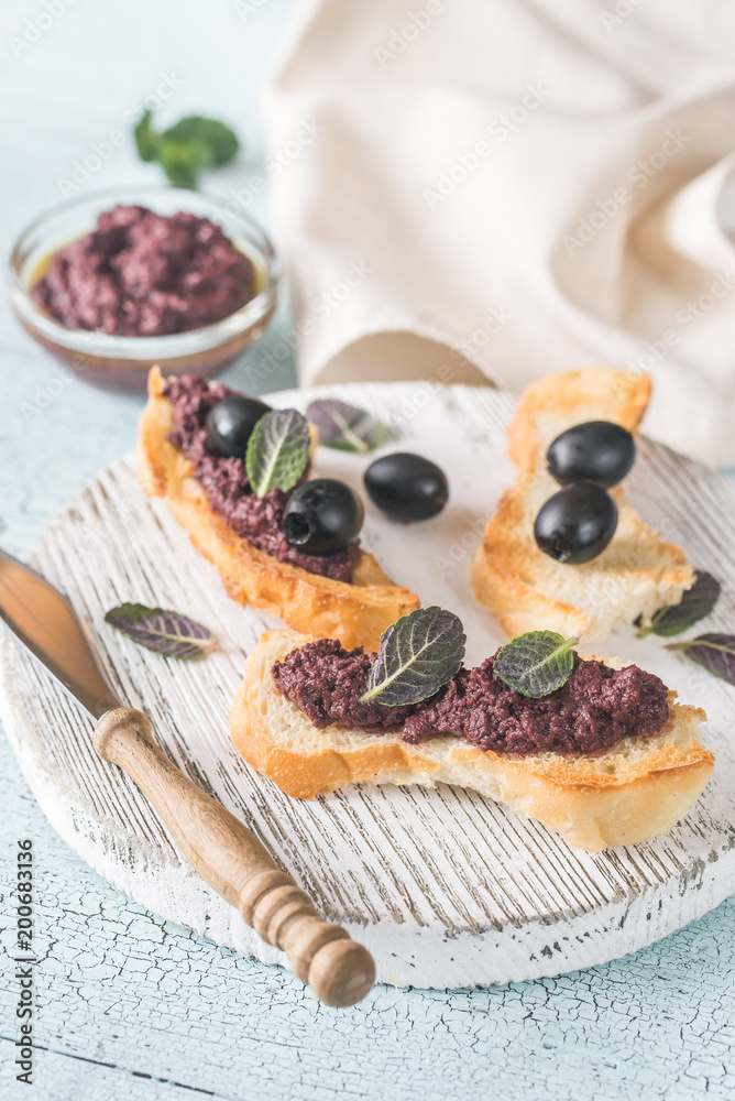 Toasts with black olive pate Toasts with black olive pate