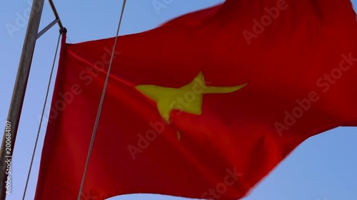 Closeup shot of a waving flag of socialist republic of Vietnam photo