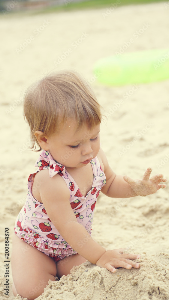 Little baby boy sitting on the sand. Happy holidays. Little baby boy sitting on the sand. Happy holidays.