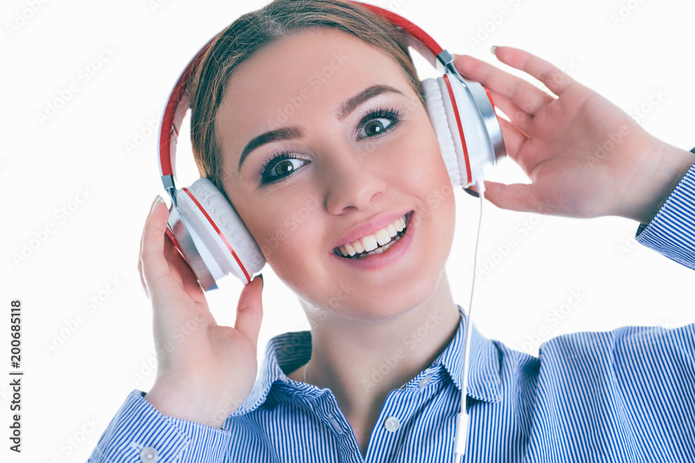 Beautiful woman with headphones daydreaming - isolated over white background. Beautiful woman with headphones daydreaming - isolated over white background.