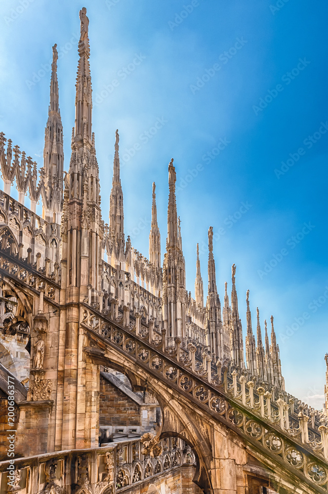 Spiers and statues on the gothic Cathedral of Milan, Italy Spiers and statues on the gothic Cathedral of Milan, Italy