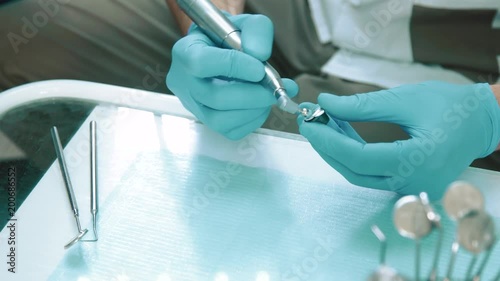 Dentist using drill machine