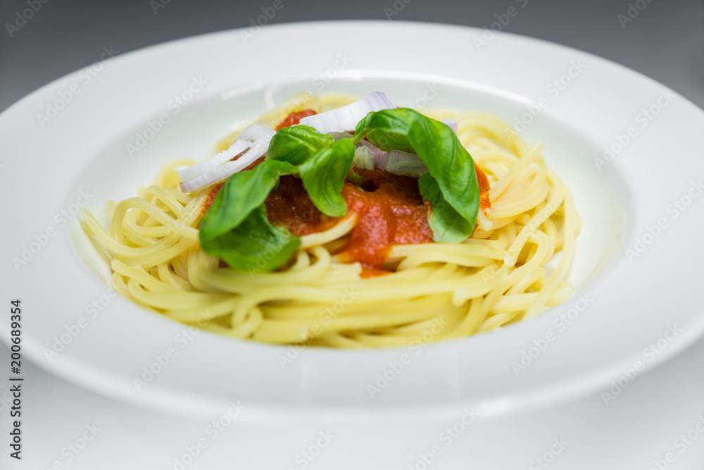 Spaghetti with tomato sauce pachino with fresh basil, a typical dish of southern Italy. The pachino tomato comes from Sicily.